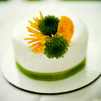 Miniature Of The Natalie Bride's Cake This was a miniature of the Bride's cake for the couple to have on their table. The larger cake had white and yellow roses along with...