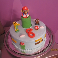 Super Mario Buttercream cake with fondant figures.