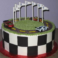 Race Car Birthday 10" cake with buttercream and fondant accents. The cars are real. Wanted to make my own, but customer called me the day before the...