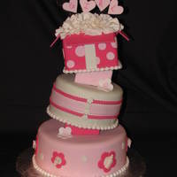 It's A Girl 8-6-4 cakes covered in Satin Ice fondant. First attempt at tospy turvy using styrofoam blocks.