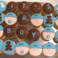 Welcome Gift For Baby Boy Vanilla bean cup cakes with white chocolate and some choclate ganche covered and decorated with fondant. Baby faces idea from Planet Cake!...