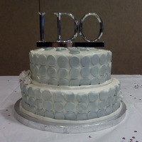 Bridal Shower butter cream icing airbrushed with pearl. fondant circles airburshed silver. Didn't wait for fondant to dry after being airbrushed so...