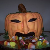 Gross Puking Pumpkin Pumpkin puking candy. Made from two bunt cakes. Fondant, buttercream, candy is all store bought. Shaded with petal dust, and tinted green...