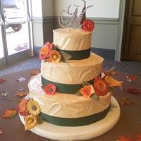 First Wedding Cake Creamcheese buttercream. With fondant flowers and green ribbon. My sister did this cake together. (scruffyandstuff) We decided to not stack...