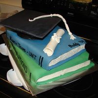 Graduation - College I made this for my husband's graduation. Books are cake covered in fondant (MMF), cap is cake covered in fondant and top flat piece is...