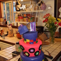 Topsy Turvy Disco Cake This is my first attempt at - a "topsy turvy" style cake with a disco theme. The colored squares represent a disco dance floor...