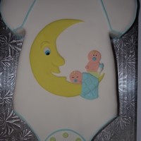 Onesie Baby Shower Cake This is my favorite cake I have made so far for a coworker.Godiva White Chocolate Liqueur Raspberry cake with vanilla buttercream frosting....