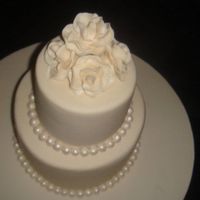 Ivory Wedding Cake With Roses And Pearls THIS IS THE FIRST WEDDING CAKE I MADE. PEARLS AND ROSES ARE HANDMADE.