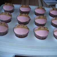 Pink Cupcakes With Brown Ribbons I've got the design from Planet Cake Book.
