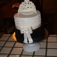 Bride And Groom Back This is the back view of previously posted cake showing lacing and bow detail.