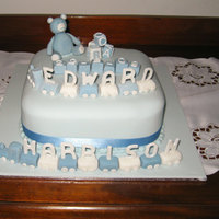 Christening Cake This was made by my Mum, for her Grandson. Decorations are all sugarpaste, with fondant icing. Thanks for looking.