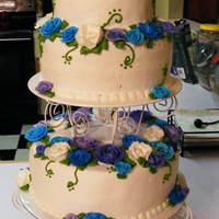Moms Birthday Cake moms 70th bday cake, white cake on bottom and top, chocolate cake in the middle layer. buttercream frosting and roses