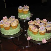 Cake/cupcake And 3 Tier Cake Stand Cake for a co-worker's going away party. The cakes are white and chocolate and the cupcakes are yellow cake and chocolate. Vanilla...