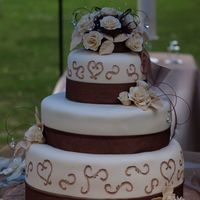 123793408241443.jpg this wedding cake was the cake from Hades!!! Nothing went the way it was supposed to with this one... I had to cover the 6 in. twice. Then...