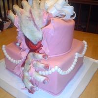 Zombie Hands Pretty pink cake with zombie hands bursting from the inside. Covered in fondant with fondant/gumpaste details. Zombie hands are also...