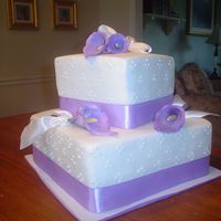 Anniversary Calla Lily Cake A husband surprised his wife with this cake for their anniversary. She loves calla lilies. Cakes are white w/vanilla bc filling and...