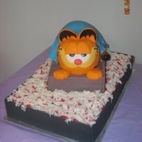 Garfield Grooms Cake This cake was made for a friends wedding. He is sitting in a pan of lasagna, doesnt quite look like lasagna, but was too late to change it...