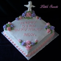 Cherub Birthday Cake cherub is fondant made from a hand made mold, edible pearls, and fondant roses on a vanilla buttercream, vanilla cake.