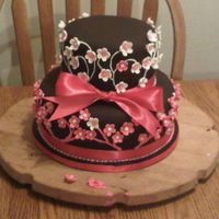 25Th Anniversary Cake This was for a 25th wedding annivesary. Chocolate sponge, chocolate ganache and strawberry filling. Covered in Chocolate fonadant white and...