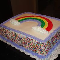 Rainbow Cake Vanilla cake with banana cream filling. All buttercream deco's.