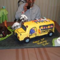 Bus Cake - 80Th Birthday In 3-D 24" four-layer bus cake with golden yellow buttercream, fondant and royal icing accessories. This cake was for an 80th birthday for a...