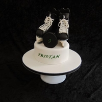 Hockey Skates Cake Made this hockey cake for my 9 yr old son's birthday. RKT hockey skates covered in BC and modeling chocolate. First time attempting...