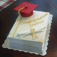 Graduation Cake This was my first attempt at making a book cake. Much harder than I expected. The marshmallow fondant was too soft for the job maybe. Red...