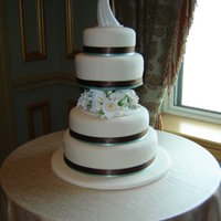 Asisted With Wedding Cake I was asked to help a friend with his first wedding cake. He designed it but I covered all the cakes. TFL