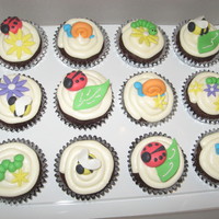 Cute Bug Cupcakes!!! Chocolate cupcakes with vanilla buttercream frosting. All of the bugs and decorations were made out of gumpaste. TFL!