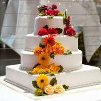 4 Tier Flower Wedding Cake 4 Tier Chocolate Mud & Fruit Wedding Cake.All flowers were made with flower fondant.