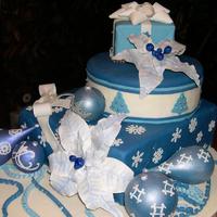 Blue Christmas Chocolate ornaments and gum paste poinsettia's and bows. This was a FUN FUN cake to make for a charity event to benefit our local...