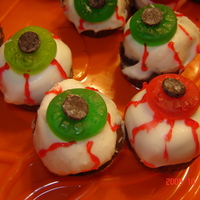 Cake Eyeballs butter cake w/ bc dipped in white chocolate, gummy lifesaver and chocolate chip eye