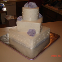 Wedding Cake chocolate cake w/ bc icing and fondant roses! Had help from (my sister) Lainvest64 thanks so much!