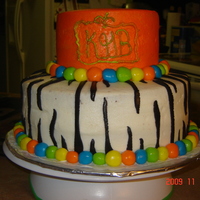 Kendall's Birthday bottom layer chocolate cake, top yellow with bc icing and rolled bc accents