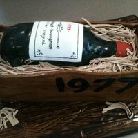 Cabernet Wine Bottle This is a carrot cake with cream cheese icing. Fondant placed on cake board and made to look like wood planks. Wine bottle is cake, fondant...