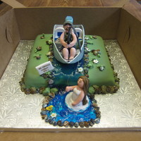 Fishing Groom Catches His Bride Boat and all details inside are all fondant and gum paste as well as the figures. Water is tinted piping gel.