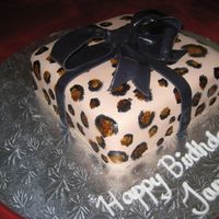 Leopard Print Gift Here's a birthday cake I made for a lady who loves leopard print. The cake was a dark chocolate malt cake with chocolate malt candy...