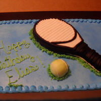 Racket Cake All frosting, except for RKT ball and racket covered in fondant.