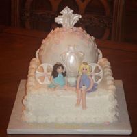 Carriage Princess 10" square and ball pan, BC icing and fondant accents. Princesses are made from fondant with BC hair.