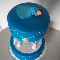 Tiered Strawberry 8 and 10in Strawberry with buttercream. Fondant flowers,cross and blanket.