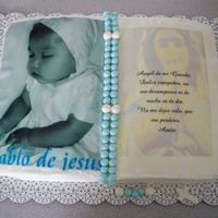 2Nd Flores Cake Book pan, buttercream icing with 2 edible images. Fondant rosary.