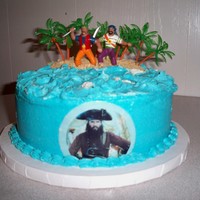 Shane's Pirate Confetti with b/c. "Island" is covered with vanilla wafers. Pirates was part of a kit. Palm trees added for island effect. I was...