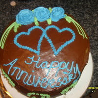 My First Anniversary Cake this is a yellow cake with chocolate icing i did this cake for a friend she loved it....