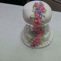 0725091137.jpg top is done in fondant and bottom is done in BC with fondant roses