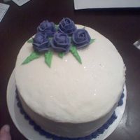 0323092124.jpg This is the first cake i have ever made. It is all butter cream. The roses look blue but really they are purple.