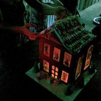 Gingerbread House Apologies for the bad photo quality, I had to take it on my phone camera and it was getting dark. The "stained glass" windows are...