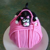 Kitten On A Ball Of Wool The ball of wool was baked in 2 mixing bowls, then covered in chocolate ganache before wrapping fondant sausages around. The kitten was...