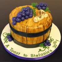 Wine Barrel 7" cake. Fondant grapes and corks. Corks and barrel painted with color/vodka mix.Thanks for looking!