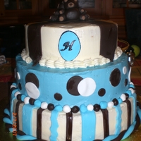 Boy's First Birthday Teddy Bear Cake This was a teddy bear cake I made last month. His nursery was in brown and blue so I made it to match.