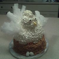 3D Chicken First attempt at a 3D Chicken sitting on nest. WASC cake with buttercream. Fondant beak and feet. Wing and tail feathers are regular craft...